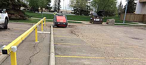 Parking lot sweeping in progress