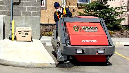 Parking lot sweeping in progress